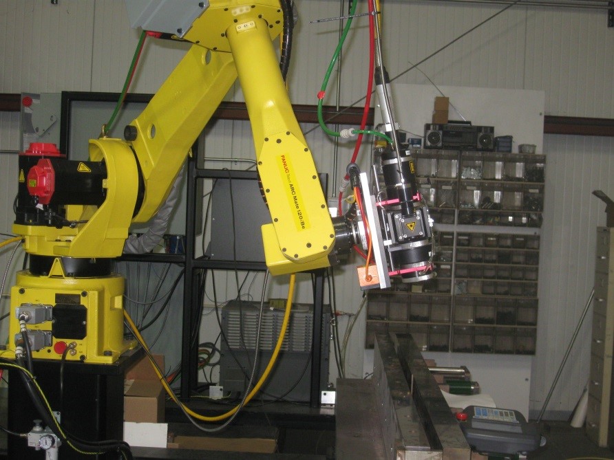 Integrated robot laser heat treating Integrated robot laser heat treating